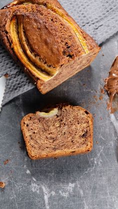 two slices of banana bread sitting on top of a table