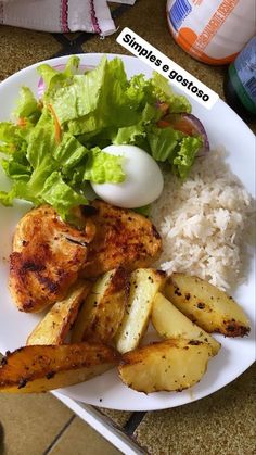 a white plate topped with chicken, rice and salad next to a bottle of water