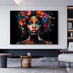 a woman with flowers in her hair is shown on the wall above a table and chair