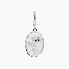 This charm features your birth flower with a rhodium finish. Adorn your jewelry collection with this elegant and delicate flower medallion, secured with a convenient hinge closure. Celebrate your birth month in style with this unique and meaningful charm. *Complete the look with the Grace Necklace and Grace Bracelet *Also available in GOLD PRODUCT DETAILS Charm: 1/2" L x 3/8" W Closure: Hinge Metal: Rhodium Plated Brass Material: Mother of Pearl with White Enamel Silver Dainty Charms, Dainty Silver Charms, Sterling Silver Flower Charm, White Gold Birth Flower Jewelry, White Gold Flower Jewelry With Birth Flower Detail, White Gold Flower Jewelry With Birth Flower, White Gold Flower Jewelry For Birth Flower, Silver Flower Charm Pendant, Mother's Day White Gold Jewelry With Flower Charm