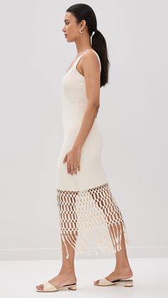 Find AMUR Archie Fringe Crochet Midi Dress on Editorialist. Fabric: Heavyweight stretch knit. Tiered crochet at hem. Round neckline. Sleeveless. Pullover design, no closure. Shell: 100% cotton. Lined. Dry clean. Imported, China. Measurements: Measurements from size S Length: 52.75in / 134.0cm, from shoulder Elegant White Crochet Knit Top, Fitted Sleeveless Crochet Dress With Crochet Trim, Chic Crochet Midi Dress With Crochet Trim, White Open Knit Crochet Dress For Spring, Elegant White Crochet Top, White Elegant Crochet Top, Elegant White Knitted Crochet Top, White Sleeveless Crochet Knit Dress, Chic Open Knit Stretch Crochet Dress