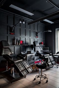 a room filled with lots of black furniture