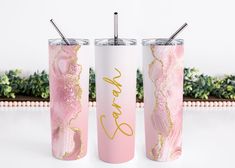 two pink and gold tumblers with matching straws