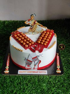 a birthday cake decorated with an image of a woman on top and beads around the edges