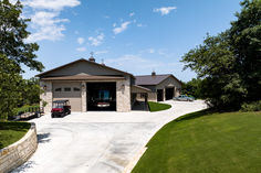 a house with a golf cart parked in the driveway