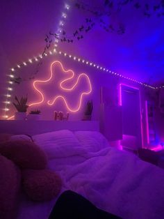 a bedroom with purple lights and a bed in the foreground, there is a white comforter on top of it