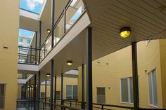 an empty building with several balconies and lights