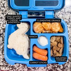 a blue lunch box filled with lots of food