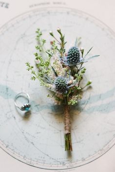 a bouquet of flowers sitting on top of a map