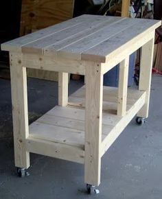 a wooden table sitting on top of a cement floor