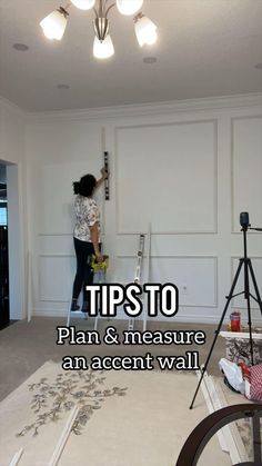 a woman is painting the wall in an empty room with text overlay that reads tips to plan & measure an accent wall