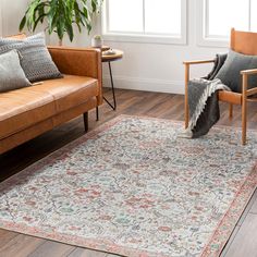 a living room with two couches and a rug