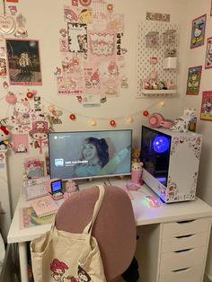 a computer desk with a bag on top of it next to a monitor and keyboard