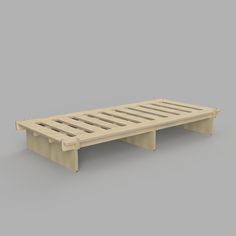 a wooden pallet sitting on top of a gray surface with no one around it