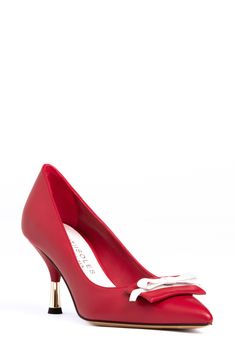 A two-tone vamp bow creates visual intrigue on a rich leather pump framed by a pointy toe and tapered metallic heel. 2 1/2" heel Memory foam cushioning Leather upper, lining and sole Made in Italy Chic Formal Heels With Red Bow, Evening Heels With Red Bow And Pointed Toe, Red Pointed Toe Heels With Bow, Leather Kitten Heels With Bow For Party, Chic Red Heels With Bow, Chic Evening Heels With Red Bow, Red High Heel With Bow, Red Bow Heels For Formal Occasions, Red High Heels With Bow