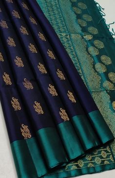 two pieces of blue and green silk with gold designs on the border, along with an intricately woven banaram