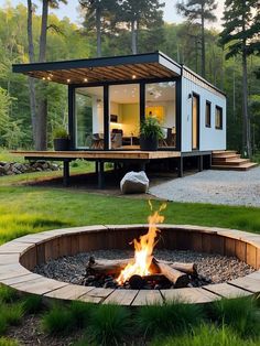 a small house with a fire pit in the yard