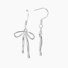 Elevate your style with our Bow Dangle Earrings! With their elegant bow design and stunning rhodium plating, these earrings are the perfect accessory to stay on trend and add some fun to your outfit. *Also available in GOLD PRODUCT DETAILS Closure: Hook Size: 1.25" L x 0.5" W Metal: Rhodium Plated Brass Sterling Silver White Gold Earrings With Bow, White Gold Sterling Silver Earrings With Bow, Silver Metal Earrings With Bow, Trendy Sterling Silver Earrings For Evening, Trendy Bow Drop Earrings, Formal Bow Earrings In Metal, Elegant Metal Bow Earrings, Silver Bow Dangle Jewelry, Silver Dangle Earrings With Bow