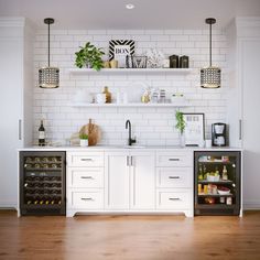 the kitchen is clean and ready for us to use it's shelves are filled with wine bottles