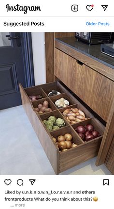 an open drawer in a kitchen filled with assorted fruits and vegetables