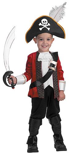 a little boy dressed in a pirate costume