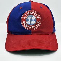 Bayern Munchen Vintage 90s Pinwheel Snapback Hat Universal Athletics Blue and Red Baseball Style Cap Green Underbill In Excellent Vintage Condition No Holes or Stains Very Clean Inside and Out One Size Fits All , Adjustable ( Snap Back ) FREE AND FAST SHIPPING IN THE USA Retro Red Hats For Baseball Season, Red Retro Hats For Baseball Season, Red Retro Hat For Baseball Season, Vintage Red Six-panel Baseball Cap, Vintage Red Baseball Cap For Sports, Vintage Red Baseball Cap For Sports Events, Vintage Red Snapback Hat For Sports Events, Vintage Red Six-panel Hat, Retro Sports Hat With Curved Bill