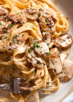 pasta with mushrooms and parmesan cheese in a bowl