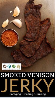 smoked venison is on the table next to some spices