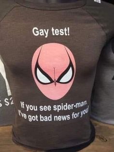 a t - shirt with the words gay test on it and an image of a spiderman