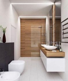 a bathroom with two sinks and a bathtub next to a shower stall in the corner