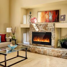 a living room filled with furniture and a fire place in the middle of the room