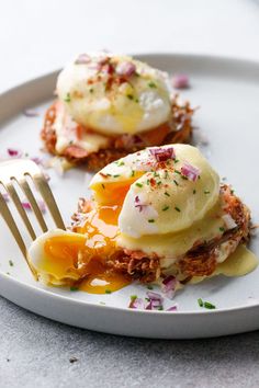 two eggs are sitting on top of an open faced sandwich with mayonnaise and sprinkles