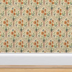 an orange and green floral wallpaper in a room with white trim on the window sill