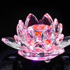 a pink crystal lotus flower on a black background