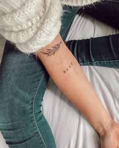 a woman's arm with a tattoo on it that reads, i love you