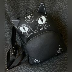 Got Lucky After Trying Multiple Stores For These Viral Halloween Purses And Found The Witchy Black Cat Mini Backpack Purse From Tj Maxx. This Was The Only Halloween Purse Left In The Store. Had To Have My Husband Guard It While I Grabbed Staff To Unlock It (He Said Someone Behind Him Was Eyeing It!). New With Tags & Tissue Stuffing Still Inside. Get It Before It’s Gone! Black Backpack For Halloween Cosplay, Black Backpack For Cosplay, Black Backpack For Halloween Travel, Black Standard Backpack For Halloween, Black Backpack For Halloween, Halloween Purses, Black Cat Design Backpack For School, Black Novelty Backpack For Halloween, Trendy Black Backpack With Cat Design