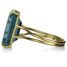 Make a bold statement but keep it minimalist in this 18k yellow gold ring from Rosanne Pugliese. An emerald cut London blue topaz sits pretty in its airy, pronged setting and ultra thin double band. Stone measures 1/2" x 5/8". Size 7. Handcrafted in Brooklyn, NY, U.S. Emerald Cut Ring, Gold Topaz, Emerald Cut Rings, London Blue Topaz Ring, 18k Yellow Gold Ring, Yellow Gold Ring, London Blue Topaz, Blue Topaz Ring, London Blue