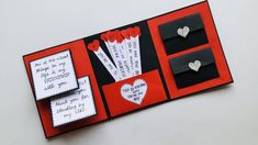 a red and black card with some hearts on it