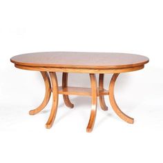 a wooden table sitting on top of a white floor