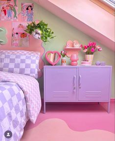 a bedroom with pink and purple decor on the walls, bedding and dressers