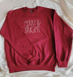 Merry and Bright Crewneck Sweatshirt | Christmas Crewneck Sweatshirt | Holiday Crewneck Sweatshirt Perfect for the Christmas/Winter Season *SWEATSHIRT INFORMATION* -Sizes are unisex. -If you prefer a larger fix, I recommend sizing up 1 size. -We offer sizes S-3XL. If you need a larger size, please message us and we may be able to special order. *CARE INFORMATION* -Please wash inside out on gentle settings and air dry for long lasting wear. -Do not dry clean. -Do not iron directly on graphic. Christmas Cotton Sweatshirt, Christmas Festive Cotton Sweatshirt, Festive Christmas Cotton Sweatshirt, Red Winter Top As Gift, Holiday Cotton Sweatshirt, Winter Relaxed Fit Tops As Gift, Relaxed Fit Tops For Winter Gift, Red Cotton Christmas Sweatshirt, Holiday Cotton Sweatshirt With Letter Print