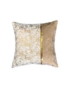 two tone gold and white pillows on a white background