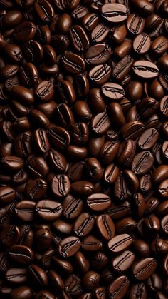 a pile of coffee beans that are brown