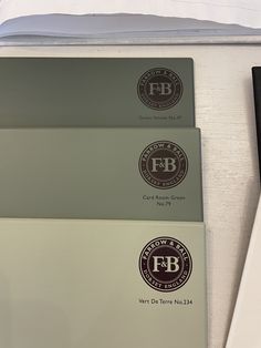 three business cards sitting on top of each other