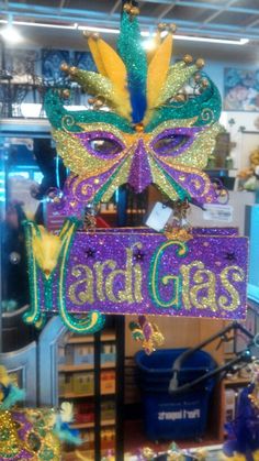 the mardi gras sign is in front of other mardi gras decorations