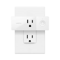 an image of a white outlet with two plugs on each side and the word wemo above it