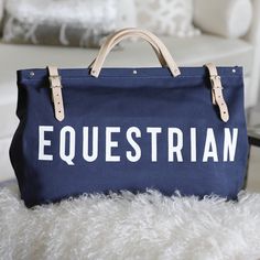 a blue bag with the word equestrian on it