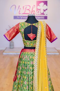 Experience timeless elegance with our Light Green and Pink Ikkat Kanchi Silk Lehenga and Yellow Mirror Work Dupatta. Made with high-quality materials, this stunning ensemble is perfect for any occasion. The intricate ikkat design and vibrant colors make it a must-have for your wardrobe. Elevate your style with our beautiful and elegant lehenga and dupatta set. Fitted Sharara With Motifs And Traditional Drape, Fitted Lehenga With Motifs For Transitional Season, Traditional Fitted Pre-draped Saree With Motifs, Fitted Art Silk Sets With Motifs, Traditional Fitted Lehenga With Motifs, Fitted Green Lehenga With Motifs, Fitted Pre-draped Saree With Motifs For Festive Occasions, Designer Fitted Anarkali Set With Motifs, Designer Ikat Print Dupatta