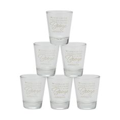 six shot glasses with different sayings on them