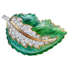 Showcasing a classic and beautiful brooch set in a green enamel leaf-like design and encrusted with 41 brilliant round diamonds, pave set weighing 0.50 carats total, F-G color and VS-SI in clarity. Perfectly made in 18k yellow gold and platinum. Style available in different color and design. Elegant Green Diamond Brooch, Luxury Green Brooch For Formal Occasions, Luxury Green Brooch For Anniversary, Luxury Green Brooches For Anniversary, Luxury Green Brooches For Wedding, Formal Green Enamel Brooches, Luxury Formal Enamel Pin, Elegant Green Enamel Pin, Elegant Green Enamel Pin Gift